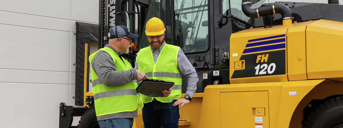 two men at a forklift